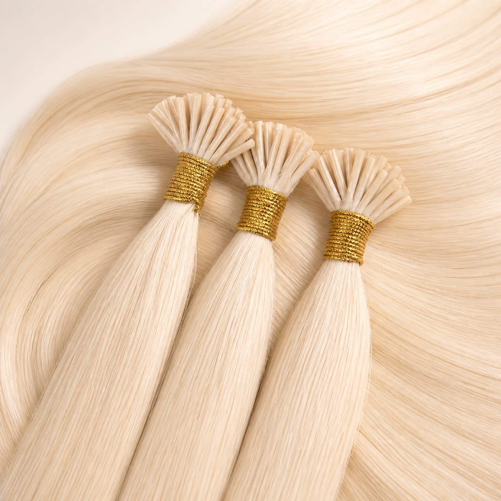 Light blonde I Tip virgin human hair extensions with cylindrical keratin bonds