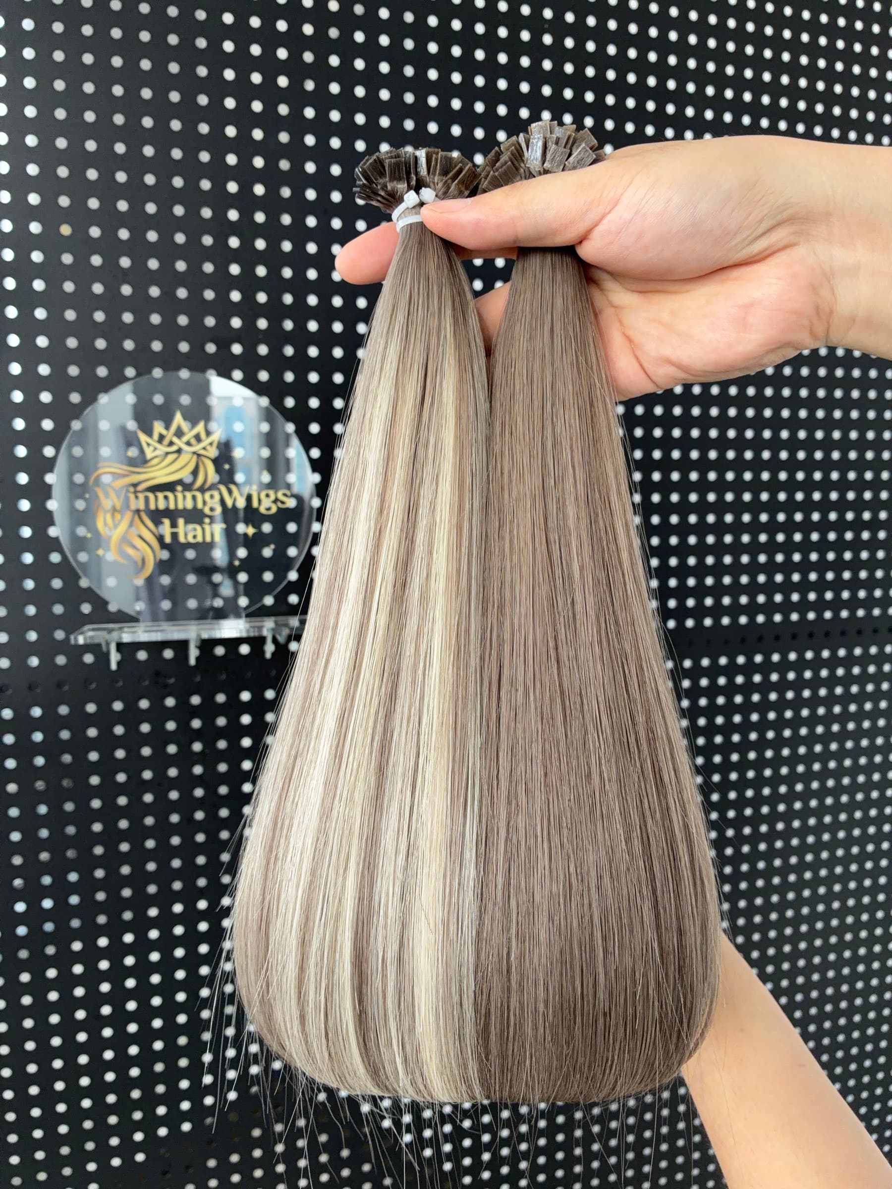 Flat Tip human hair extensions in ash blonde and ash brown, showing the flat keratin bond ends