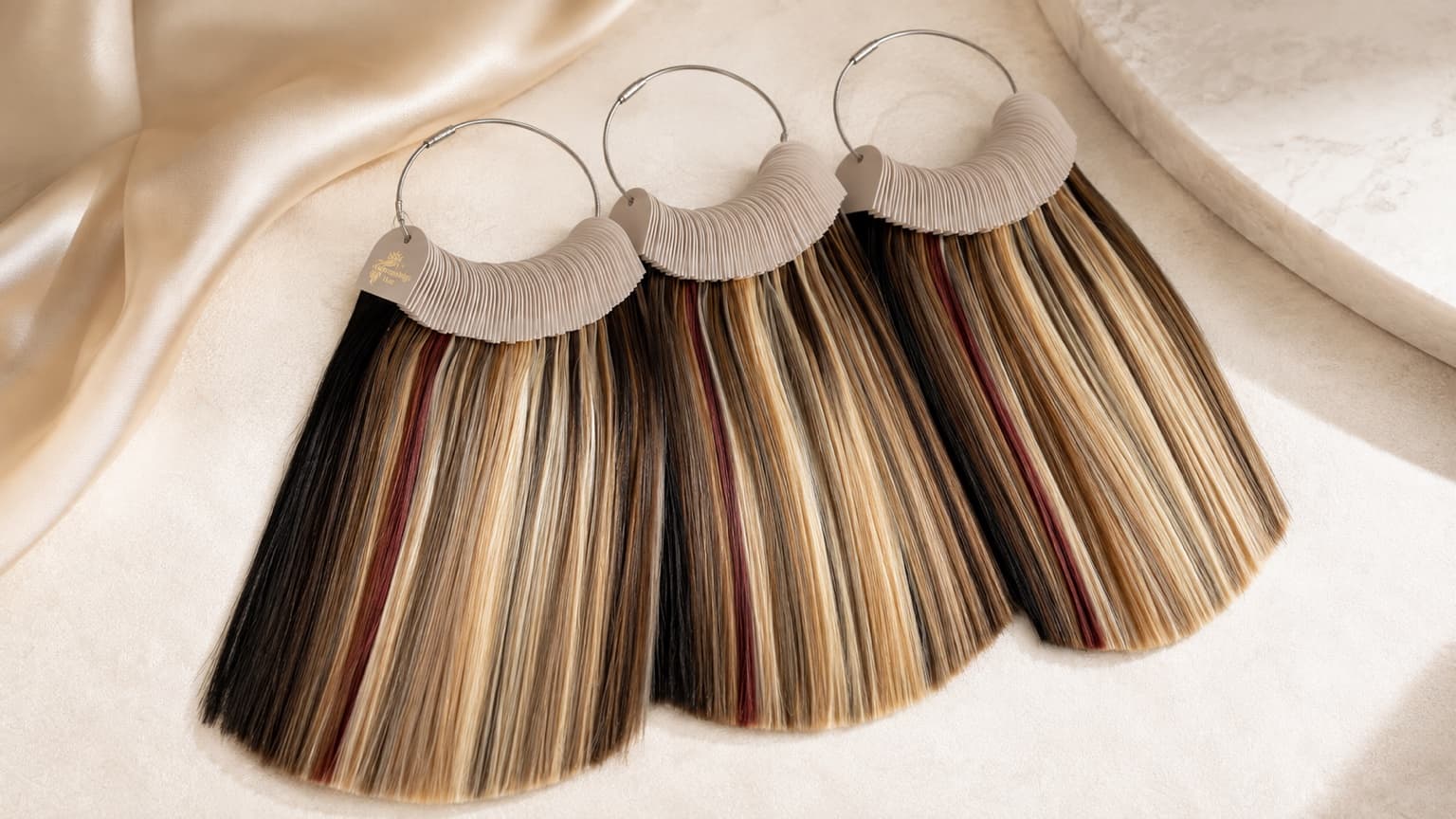 WinningWigs private-label human hair colour rings with a champagne-gold logo on the left identification tag